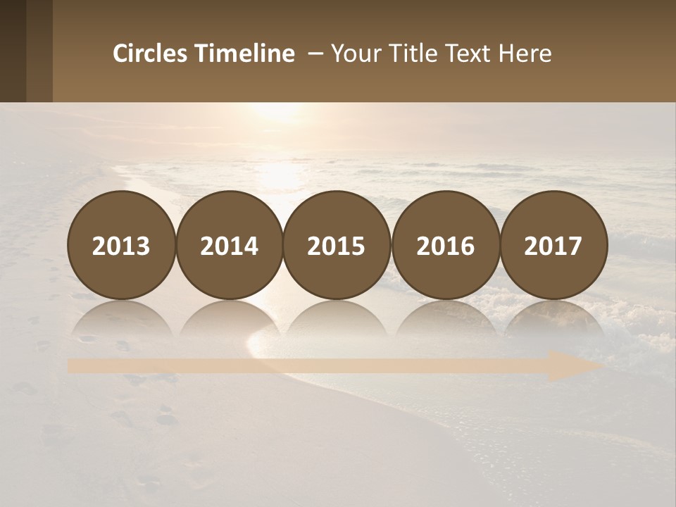 A Sandy Beach With Footprints In The Sand PowerPoint Template