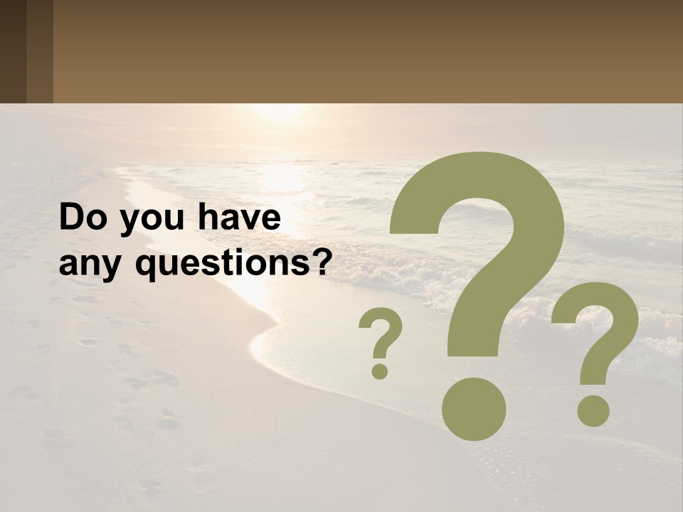 A Sandy Beach With Footprints In The Sand PowerPoint Template