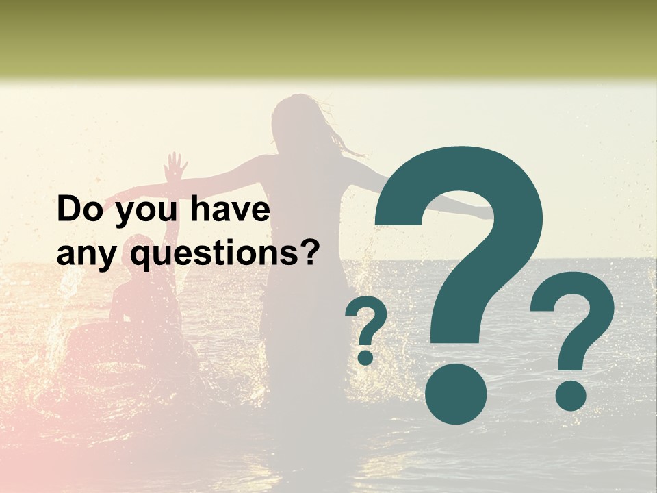 A Group Of People Playing In The Water At Sunset PowerPoint Template