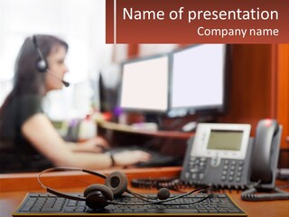A Woman Sitting At A Desk With Headphones On PowerPoint Template