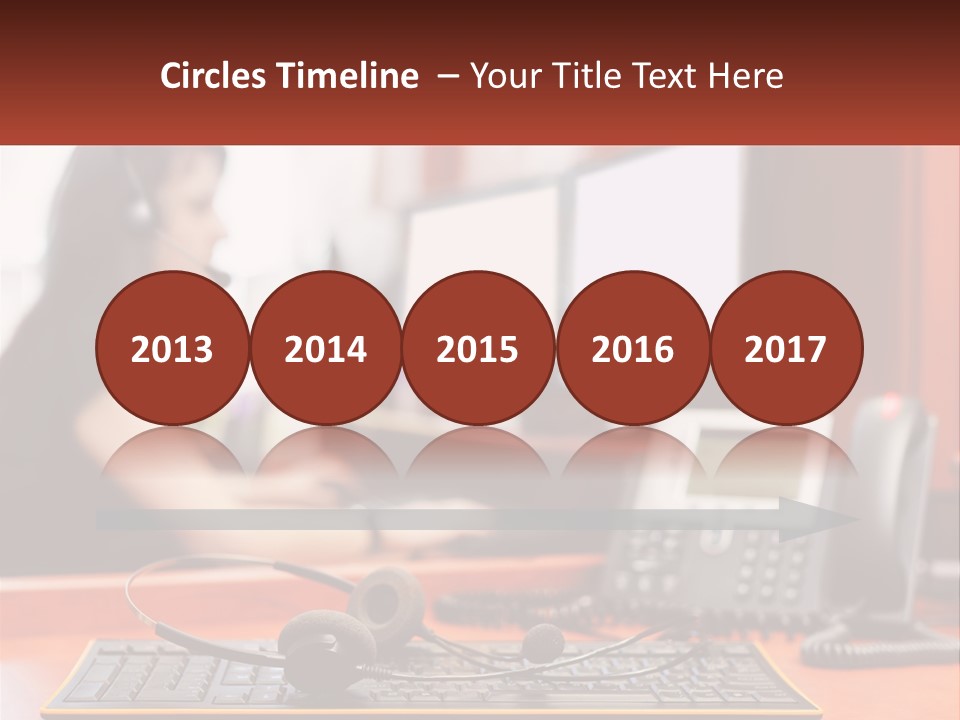 A Woman Sitting At A Desk With Headphones On PowerPoint Template