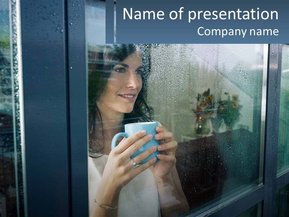 A Woman Holding A Cup Looking Out A Window PowerPoint Template