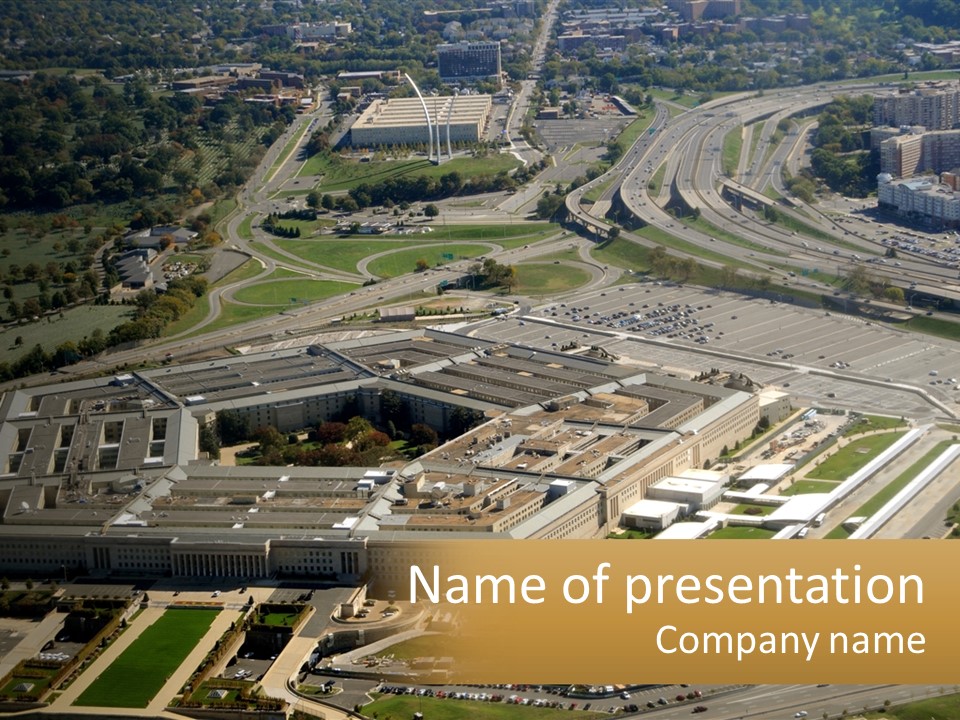 An Aerial View Of A Large Building In A City PowerPoint Template