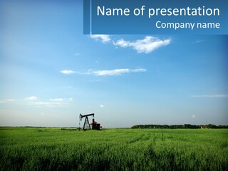 A Tractor In A Green Field With A Blue Sky In The Background PowerPoint Template