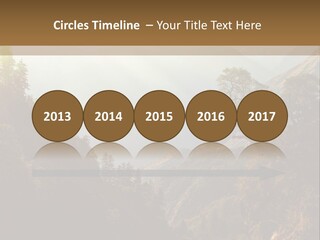 A Picture Of A Mountain Range With Trees In The Foreground PowerPoint Template