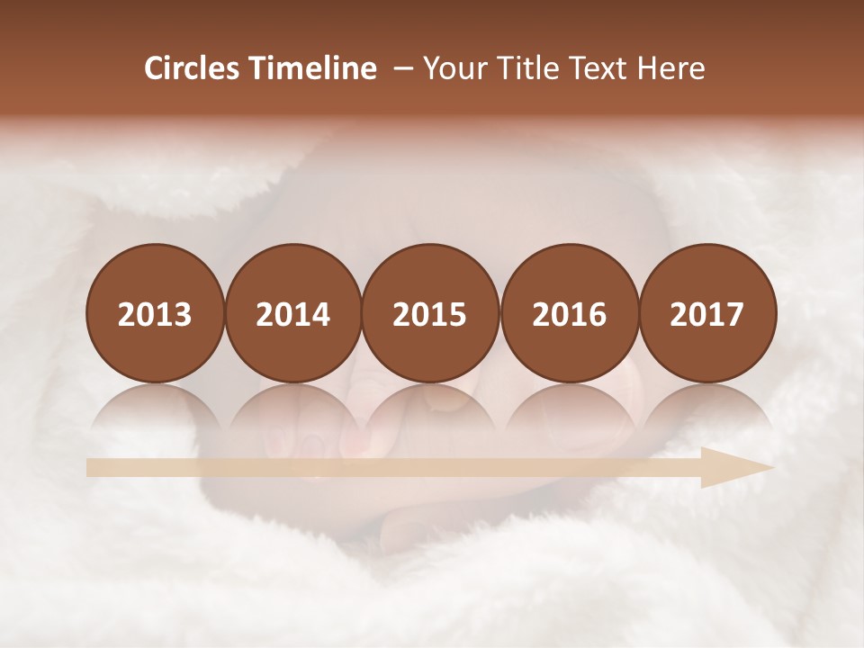 A Baby's Hand Wrapped In A Blanket PowerPoint Template