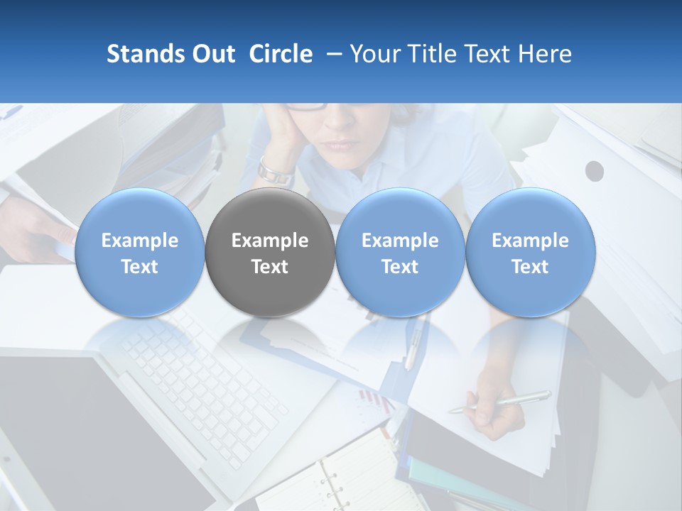 A Woman Sitting At A Desk With A Laptop And Papers PowerPoint Template