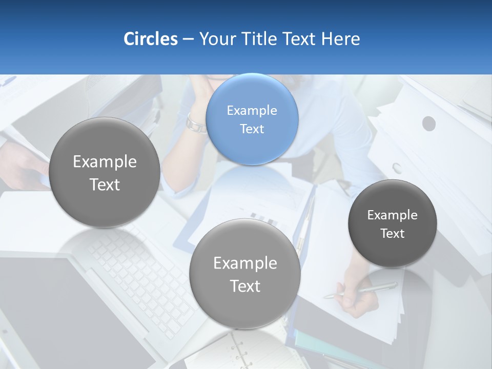 A Woman Sitting At A Desk With A Laptop And Papers PowerPoint Template