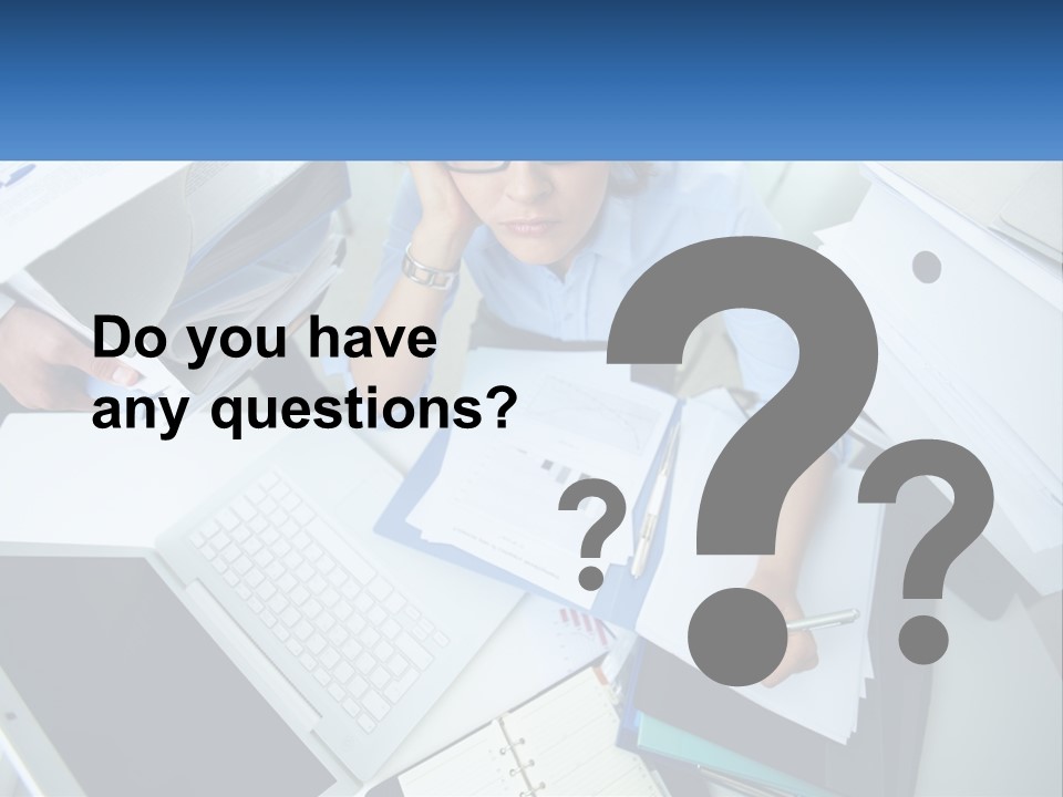 A Woman Sitting At A Desk With A Laptop And Papers PowerPoint Template