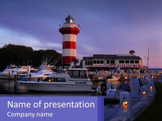 A Red And White Light House Sitting On Top Of A Body Of Water PowerPoint Template