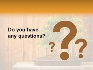 A Bonsai Tree On A Table In Front Of A Wooden Wall PowerPoint Template