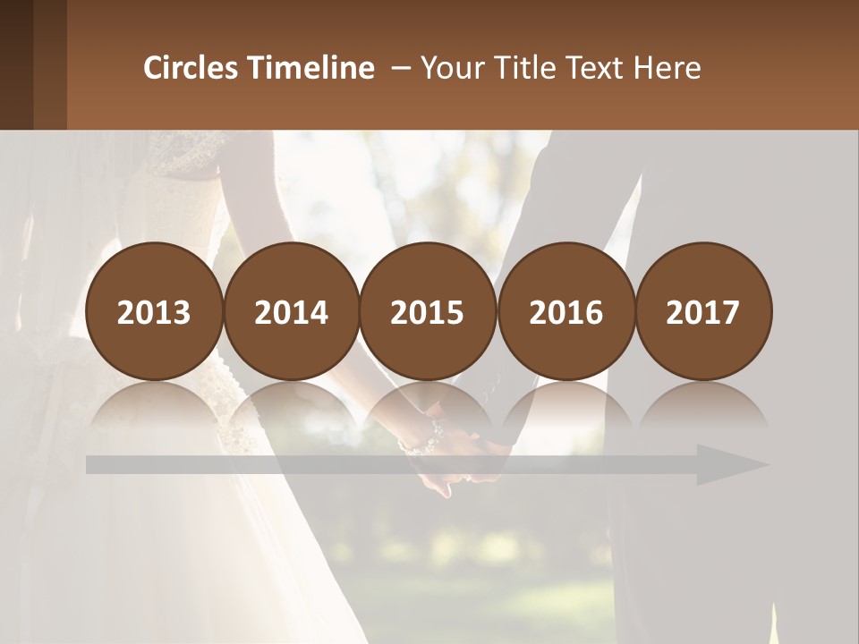 A Bride And Groom Holding Hands In A Park PowerPoint Template