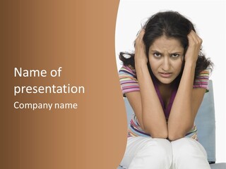 A Woman Sitting On A Couch With Her Hands On Her Head PowerPoint Template