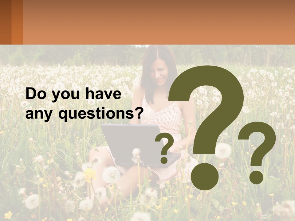 A Woman Sitting In A Field With A Laptop PowerPoint Template