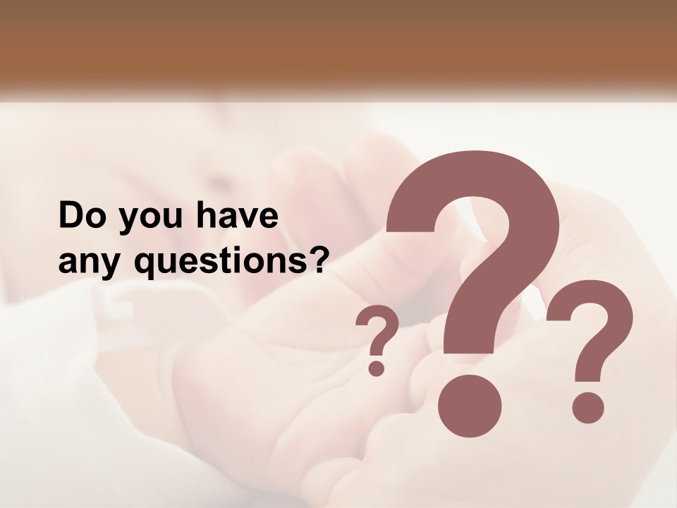 A Person Holding A Baby In Their Hands PowerPoint Template