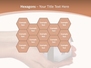 A Person Holding A Small House In Their Hand PowerPoint Template