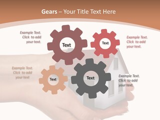 A Person Holding A Small House In Their Hand PowerPoint Template