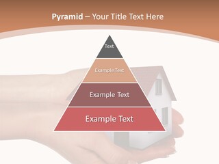 A Person Holding A Small House In Their Hand PowerPoint Template