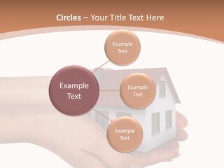 A Person Holding A Small House In Their Hand PowerPoint Template