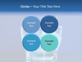 A Glass Of Blue Liquid With A Spoon In It PowerPoint Template