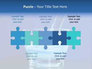 A Glass Of Blue Liquid With A Spoon In It PowerPoint Template