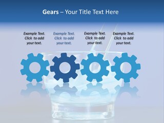 A Glass Of Blue Liquid With A Spoon In It PowerPoint Template