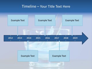 A Glass Of Blue Liquid With A Spoon In It PowerPoint Template