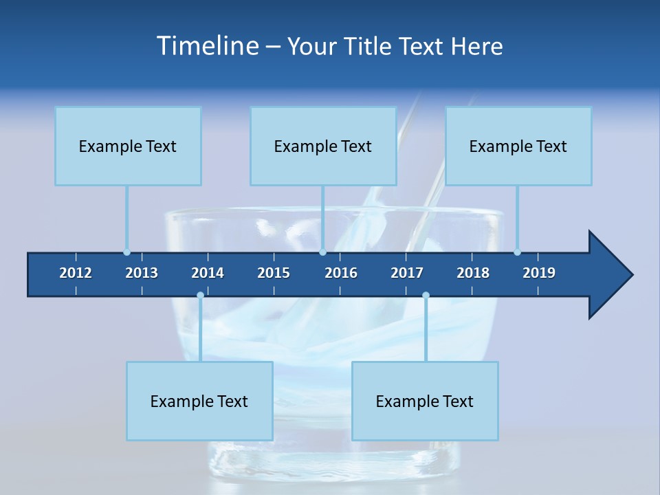 A Glass Of Blue Liquid With A Spoon In It PowerPoint Template