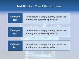 A Glass Of Blue Liquid With A Spoon In It PowerPoint Template