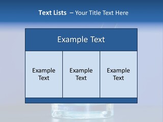 A Glass Of Blue Liquid With A Spoon In It PowerPoint Template