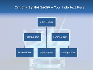 A Glass Of Blue Liquid With A Spoon In It PowerPoint Template