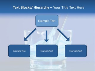 A Glass Of Blue Liquid With A Spoon In It PowerPoint Template