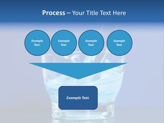 A Glass Of Blue Liquid With A Spoon In It PowerPoint Template