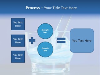 A Glass Of Blue Liquid With A Spoon In It PowerPoint Template