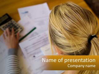 A Woman Sitting At A Desk With A Calculator PowerPoint Template