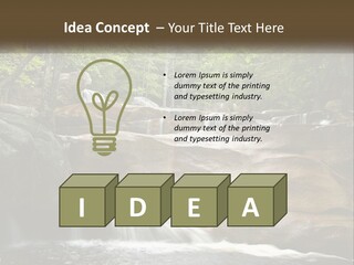 A Waterfall In The Middle Of A Forest PowerPoint Template