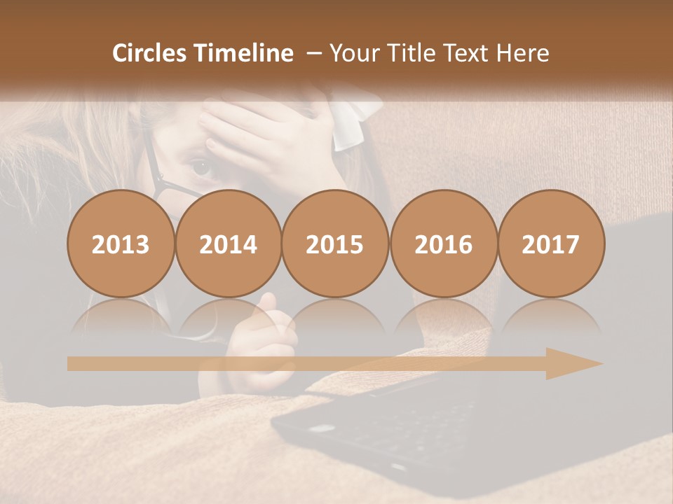 A Little Girl Sitting On A Couch Looking At A Laptop PowerPoint Template