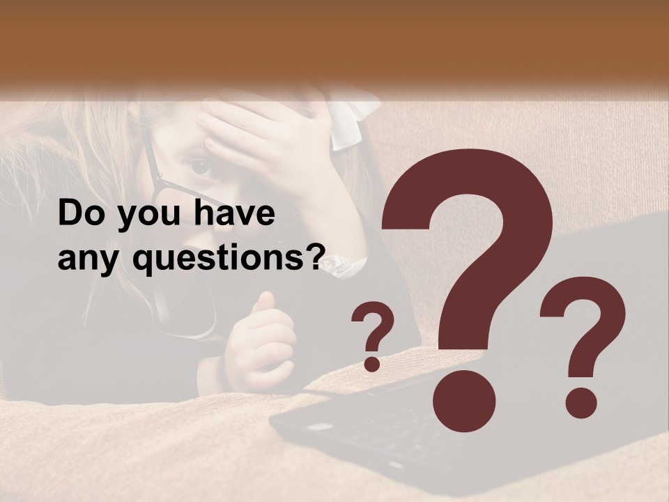 A Little Girl Sitting On A Couch Looking At A Laptop PowerPoint Template