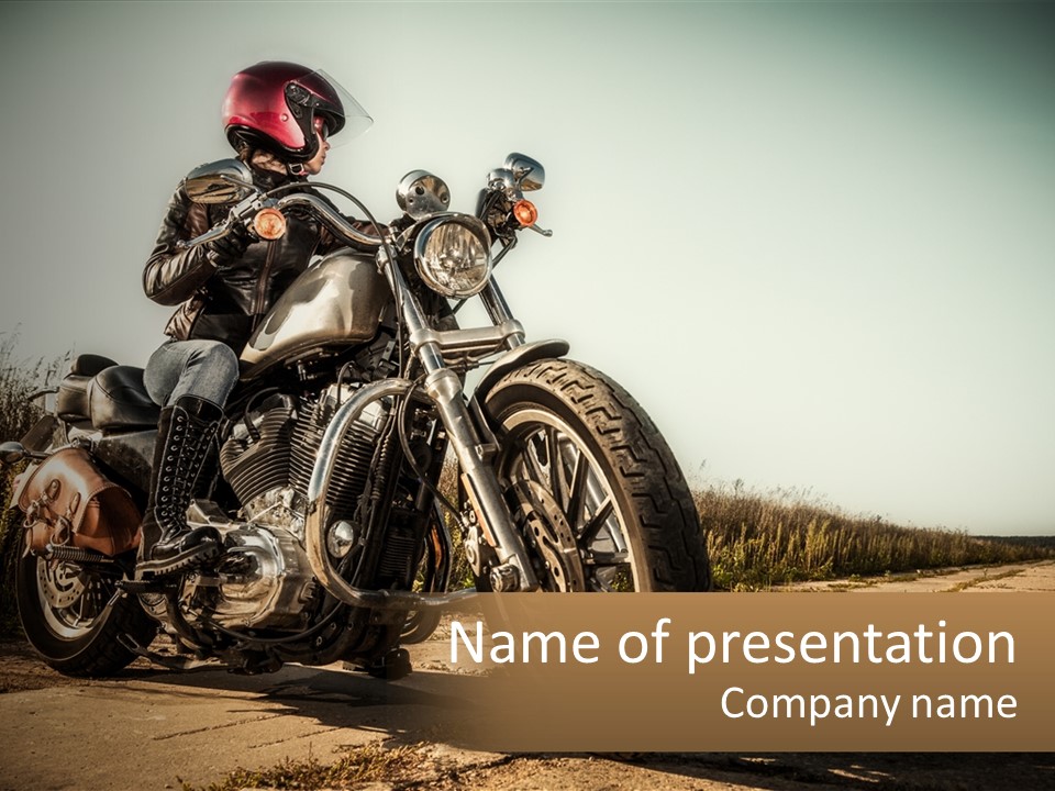 A Man Riding A Motorcycle Down A Dirt Road PowerPoint Template