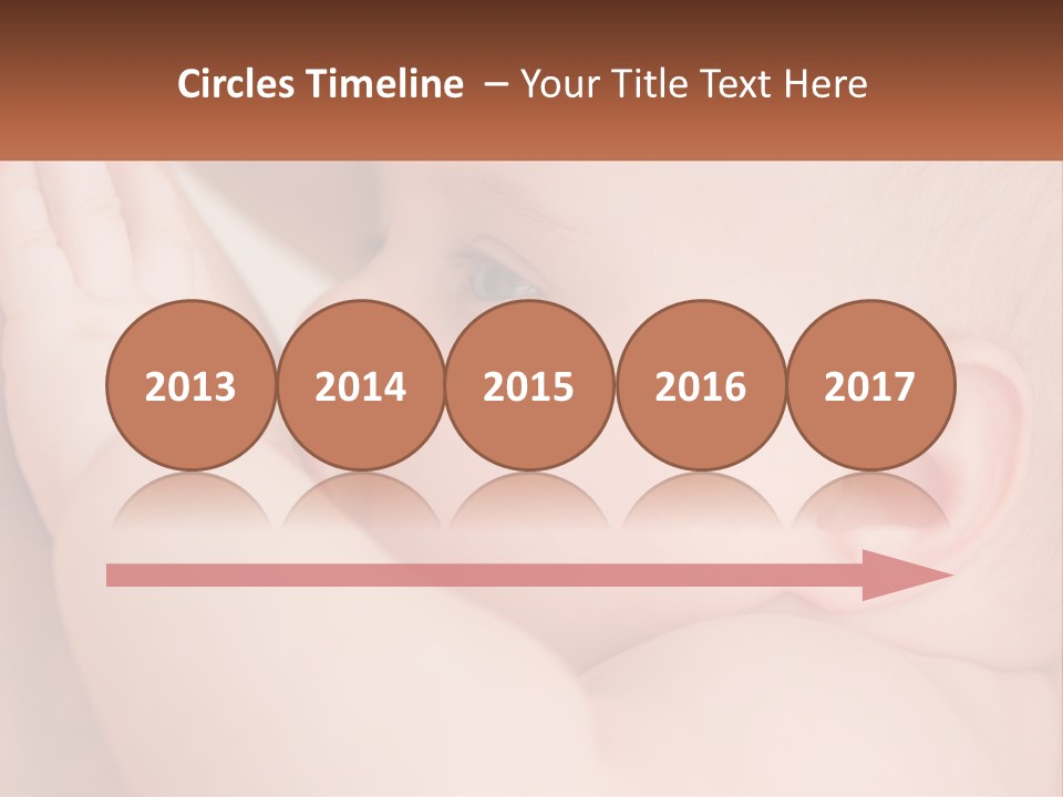 A Baby Is Holding Its Hand Up To Its Face PowerPoint Template