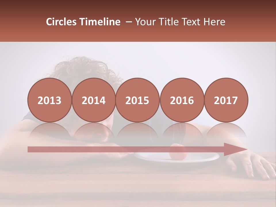 A Man Leaning Over A Table With A Plate Of Food On It PowerPoint Template