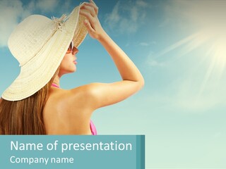 A Woman In A Hat Is Standing On The Beach PowerPoint Template