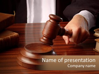A Person Holding A Wooden Gaven On Top Of A Table PowerPoint Template