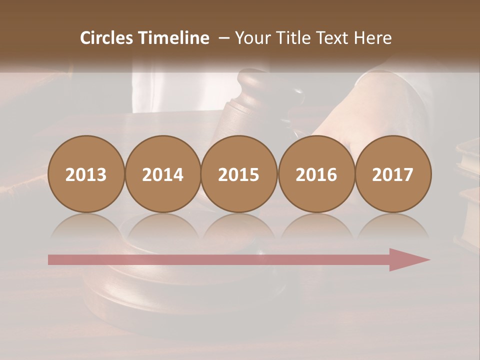 A Person Holding A Wooden Gaven On Top Of A Table PowerPoint Template