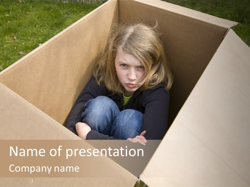 A Little Girl Sitting Inside Of A Cardboard Box PowerPoint Template