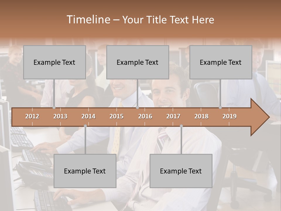 A Group Of People Sitting In Front Of Computers PowerPoint Template