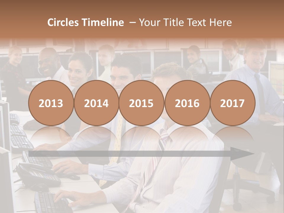 A Group Of People Sitting In Front Of Computers PowerPoint Template