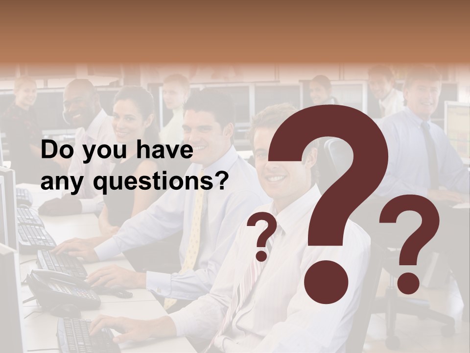 A Group Of People Sitting In Front Of Computers PowerPoint Template