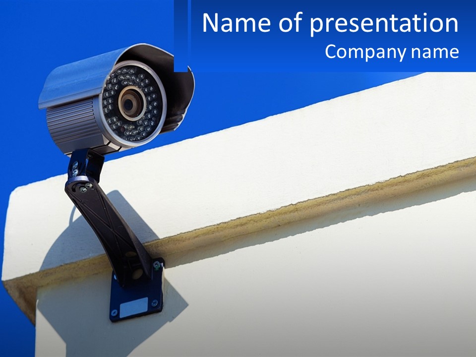 A Security Camera On The Side Of A Building PowerPoint Template