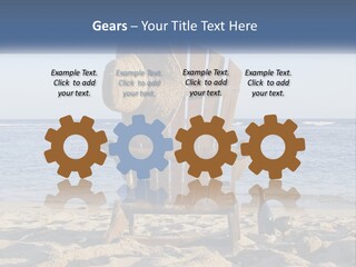A Wooden Chair Sitting On Top Of A Sandy Beach PowerPoint Template